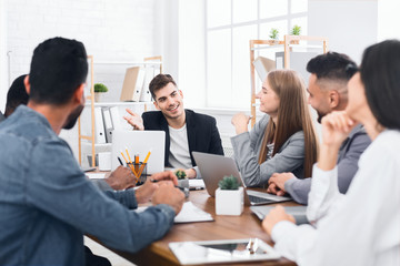 Group of young business people working and communicating