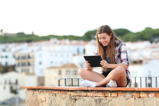 Happy Teenage Female Watching Media On Tablet