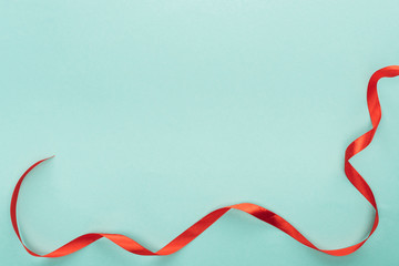 background with red ribbon isolated on turquoise