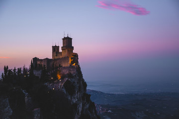 Obraz premium panoramic view of ancient medieval San Marino fortress on a winter sunset with few clouds