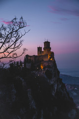 Obraz premium panoramic view of ancient medieval San Marino fortress on a winter sunset with few clouds