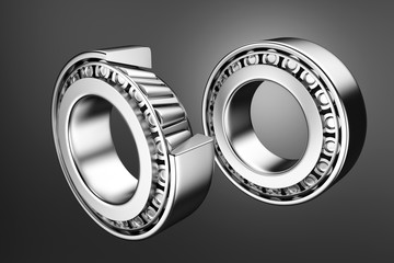 3D rendering. Automotive bearings auto spare parts. Tapered roller bearing isolated on a dark background. Wheel bearing for truck, heavy duty and car.