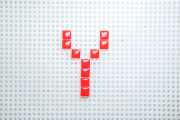 letter Y created with children toys similar to pixels