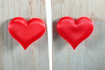 Two red hearts. Divorce and separation concept. Breaking up background.