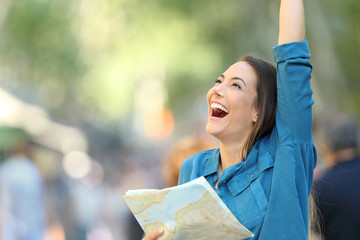 Excited tourist celebrating vacation in the street