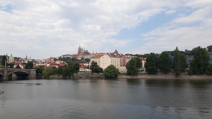 view of castle and charles bridge in prague