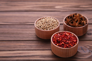 Spices mix on a brown wooden background. Top view