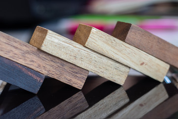 Growing business concept. Business Woman picking domino blocks for filling the missing dominus and protect domino to fail.