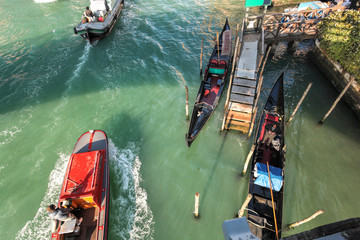 Gondolas with motor boats on Grand canal in Venice, Italy