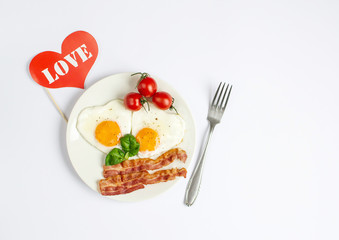 Tasty Fried Egg in the Shape of a Heart Served on a White Plate with Bacon Tomato Basil Pepper Background Valentine Day Breakfast