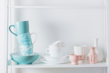 Clean dishes on wooden shelf