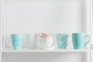 Clean dishes on wooden shelf