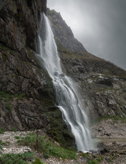 Fototapeta na wymiar water flows from the waterfall flowing down the rock