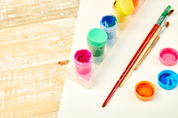 Watercolor palettes and paint brushes. Artist workplace