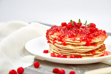 American pancake with jam - berry, viburnum, cranberry