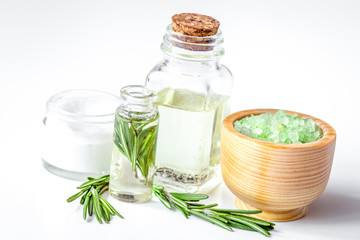 organic cosmetics with extracts of herbs rosemary on white background