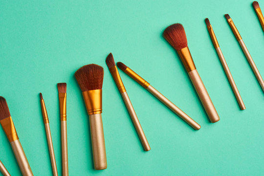 Makeup Brushes, Everyday Make-up Tools. Cosmetic Essentials On Bright Background, Flat Lay.