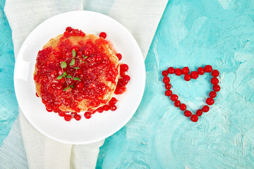 American pancake with jam - berry, viburnum, cranberry