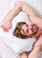 Fototapeta na wymiar Get adequate and consistent amount of sleep every night. How much sleep you actually need. Bearded man sleeping face relaxing on pillow. Man handsome guy lay in bed. Expert tips on sleeping better