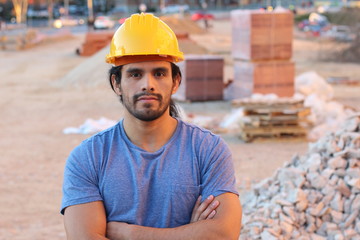 Muscular tough construction worker with arms crossed - Powered by Adobe