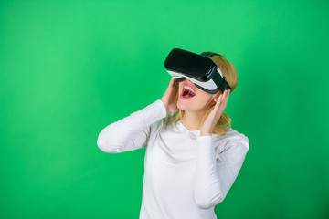 Woman using virtual reality headset. The woman with glasses of virtual reality. Woman wearing...