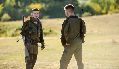 Man hunters with rifle gun. Boot camp. Military uniform fashion. Friendship of men hunters. Army...