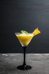 Freeze pineapple cocktail in martini glass. Selective focus. Shallow depth of field.