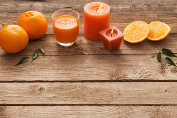 spa concept with orange fruits on old wooden background