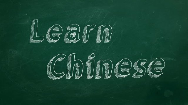 Hand drawing "Learn Chinese" on green chalkboard