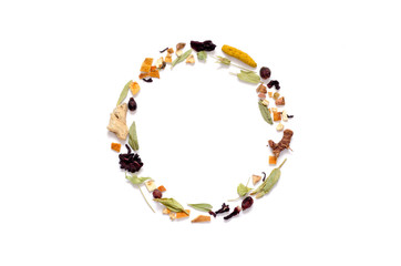 Frame with herbal tea, dry herbs and flowers with pieces of fruit and berries. Top view. Copy space