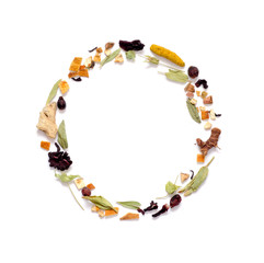 Frame with herbal tea, dry herbs and flowers with pieces of fruit and berries. Top view. Copy space