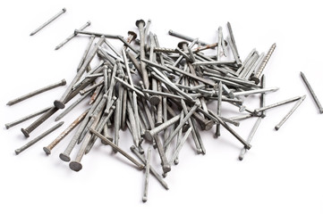 Pile of metal nails on a white background.