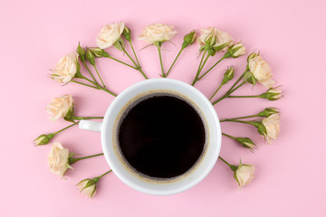 Beautiful mini roses and a notebook on a bright pink background. holidays. Valentine's Day. women's Day. view from above.