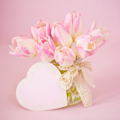 Lovely bunch of flowers.Gentle pink tulips on a pink background.