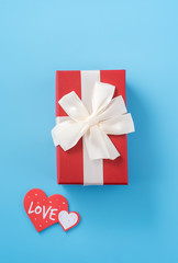 Concept of beautiful Valentine's day, anniversary, mother's day and birthday present and greetings on blue background, copyspace, topview, mockup