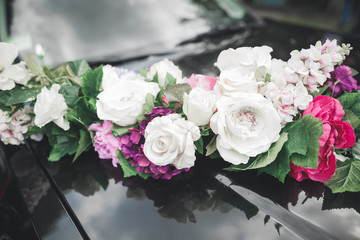 Wedding car decorated with beautiful, luxury flowers