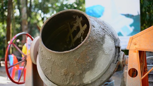 Concrete Mixer Mixing Mortar on Construction Sites and Kneading Concrete.
