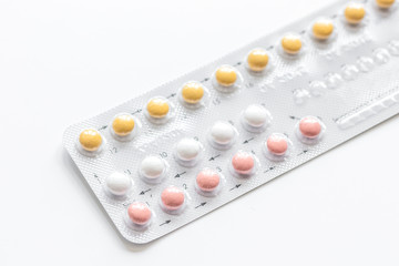 concept of female contraception on white background