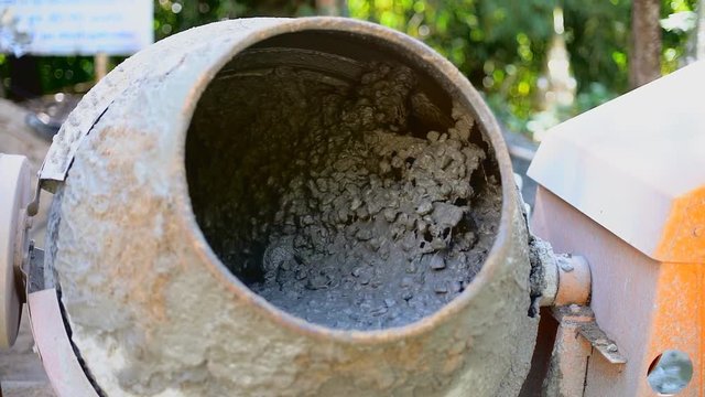 Concrete Mixer Mixing Mortar on Construction Sites and Kneading Concrete.