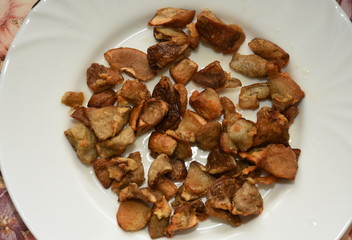 mushrooms fried on a white plate