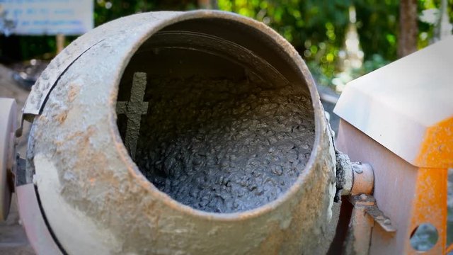 Concrete Mixer Mixing Mortar on Construction Sites and Kneading Concrete with Slow Motion. 