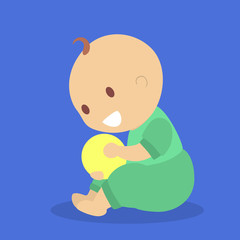 Cute little baby boy playing with a small ball