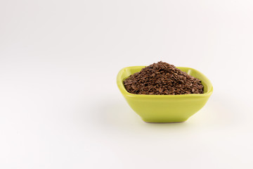 flax seeds in bowl on table background
