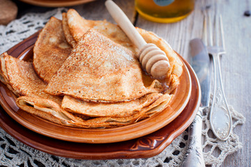 Pancakes for carnival with honey in Russian style, horizontal