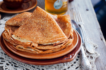 Pancakes for carnival with honey in Russian style, horizontal
