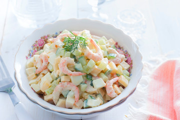 Salad with shrimps, cucumber, eggs and cheese, horizontal