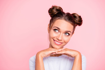 Close-up portrait of her she nice lovely attractive fascinating winsome cheerful girl with buns looking up aside isolated over pink pastel background