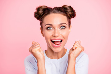 Close-up portrait of her she nice-looking crazy lovely attractive cheerful cheery glad funny girl with buns holding fists opened mouth isolated over pink pastel background - obrazy, fototapety, plakaty