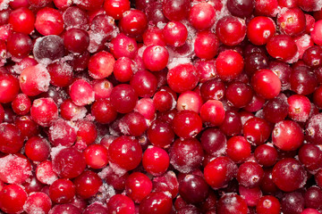 Lots of frozen cranberries. background, texture of berries. Abstract background for design or project.