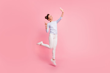 Fototapeta premium Full length body size view of nice cute winsome attractive lovely sweet cheerful cheery positive girl showing v-sign making selfie isolated over pastel pink background